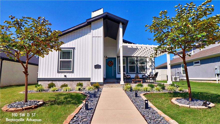 WELCOME HOME TO THIS DOWNTOWN BENTONVILLE CHARMER! Built in 2019 this home has an open plan with vaulted ceilings and custom wood feature wall. There are 4 bedrooms and 3 full baths all on one level PLUS a fantastic new 500+ sq ft addition upstairs. New 2-car covered parking and a single-car, attached garage area leads into a large, private patio with custom fence and planters for a great place to entertain or just hang out and relax. There is also a good-size, adorable front porch that looks out to Gilmore Park. Walk or bike to the Bentonville Square, Crystal Bridges, The Momentary for fun, food, shopping and everything else DTB has to offer. It’s all right here!!!