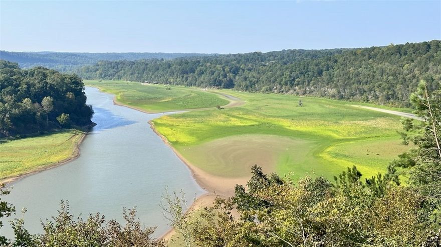 Beaver Lake front/view! This breathtaking property boasts 365.26 feet of lake frontage. Hunters and nature lovers escape! Enjoying natural spring yearround, small caves, stunning sunsets, fishing, deer hunting, abundant wildlife, and endless outdoor adventures, everything right on your own land. Despite its peaceful seclusion, in 32 minutes you can be in downtown Rogers, Fayetteville, and Springdale, where you’ll find restaurants, shopping, and entertainment. No deed restrictions—giving you the freedom to build and enjoy as you wish. Beauty awaits you as you build your dream home retreat! Old house was demolished at 2023. Electric meter was removed, but can be replaced 24 hours.