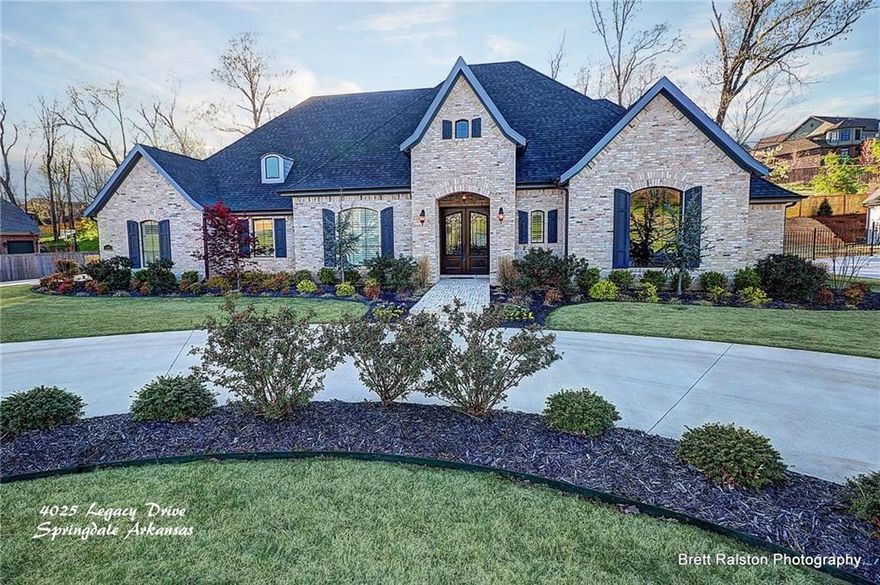 Sold Before Print. Beautiful custom home in desirable Heritage Hills gated community. This home boasts hand scraped hardwood floors, ceramic tile, granite counter tops, large central island, formal dining room, open floor plan, living room has vaulted ceilings with exposed beams, walk in closets throughout, private office with French doors. Upstairs is a large bonus room perfect for the teenager or a great movie or play room. Out back relax under the covered patio with built in fire place while the kids swim in the heated pool. A huge 709 sf detached two car garage in addition to 3 car attached garage with a 522sf heated and cooled full apartment above for the pesky Mother-In-Law to live on property, but not in the house. Easy access to I49. Total square footage includes square footage in heated and cooled garage apartment.