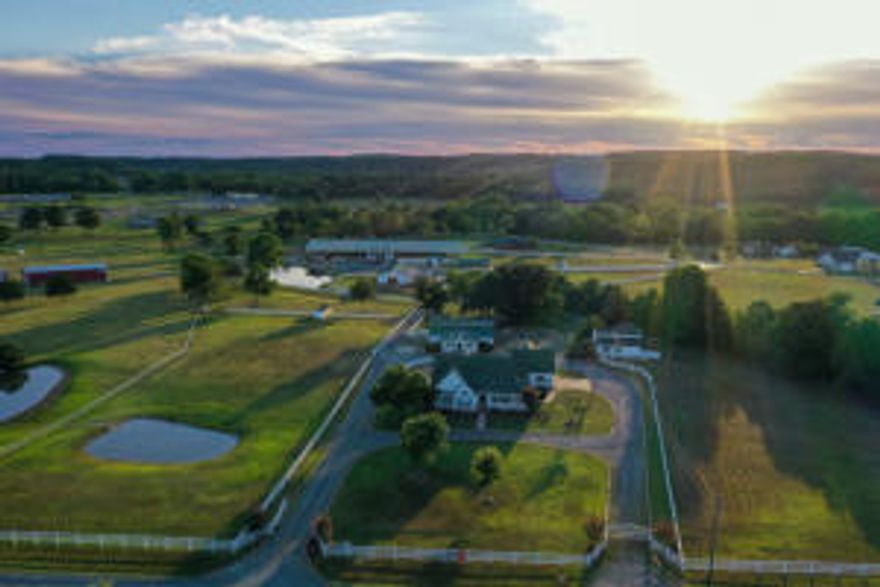 Exceptional Horse Ranch property with 2 homes and over 33000 sf riding arena.ThisTurn-key ranch has all the amenities already in place for its new owner. Starting with a beautiful 3b/2b 2349sf Ranch home that features an in ground pool, fireplace, 2 car garage, pool house, outdoor bar area and much more all overlooking your picturesque country setting. A separate 3b/2b 2384sf Beautiful Log home that features a fireplace, screened in porch,  office, cathedral ceilings, 1 storage building, an attached workshop and sets along side Scroggins creek that is just full of bass for some additional beauty and outdoor recreation. You will be amazed at the over 33,000sf riding arena that is already set up for roping and barrels.