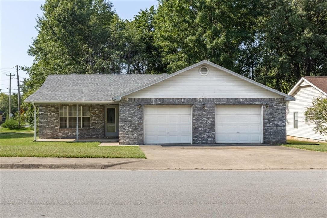 Fabulous location close to the U of A, shopping, trails, and I-49! This home features a spacious open layout with a split floor plan, including a huge kitchen with plenty of cabinets and counter space. Situated on a desirable corner lot, it also offers a massive 760 sq. ft. garage and a new roof already in place. With a little TLC, this property has the potential to truly shineāan excellent opportunity to make it your own. Home is sold As Is and priced accordingly.