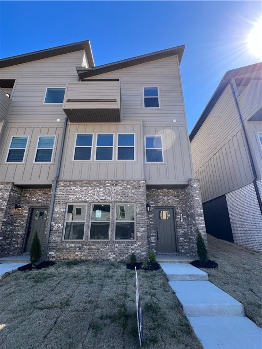 New Construction Modern Townhome!  This townhome offers 2 living areas perfect for entertaining, custom built cabinets, granite countertops, each bedrooms has its own bathroom so no sharing, walk in closets!  This area offers easy access to I-49 and close to the University of Arkansas.  Agent related to seller.  Perferred lender offering credit of upto $3500   Frigerator, washer and Dryer included!