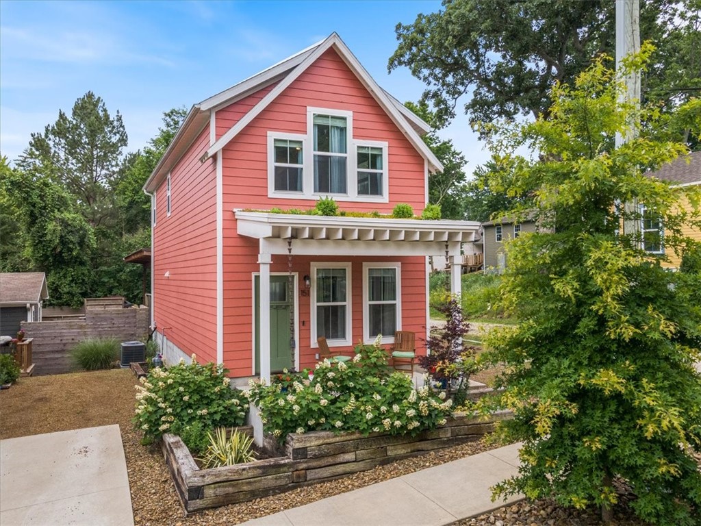 Well maintained, energy-efficient home in the heart of South Fayetteville. Vegetated green roof over front porch by Ozark Greenroofs. Home has 9' ceilings downstairs, ample natural light, open floor plan, granite countertops, energy-star appliances, smart thermostat, and low-maintenance exterior and landscaping. Refrigerator, washer & dryer, security system, and Nest thermostat convey. Includes two off-street parking spaces accessed by shared drive. Walkable neighborhood near Walker Park, the Razorback Greenway trail, community gardens, Senior Center, and restaurants and businesses on S School Ave. Carport behind the house belongs to the neighbors and is not included in the sale. Seller requests offers expire after 5:00 pm on Monday 6/19.