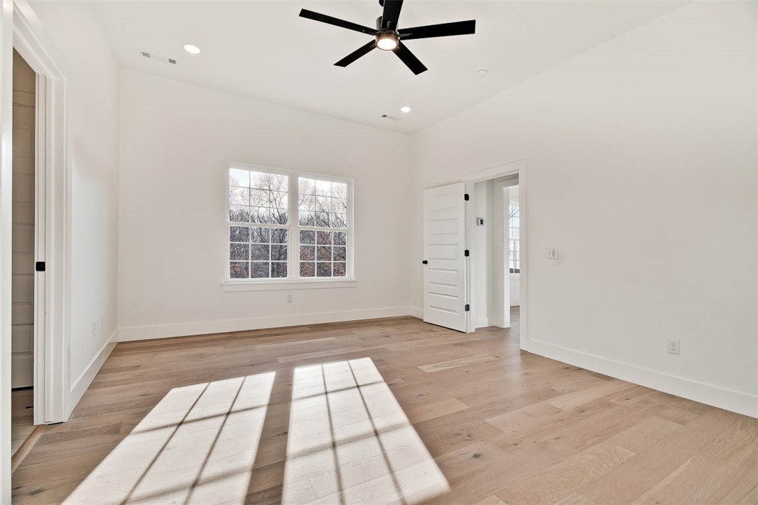 New construction on a wooded lot directly on the Back 40 Trail! This stunning property offers the perfect blend of nature and nearby amenities. Conveniently located close to the Lake Ann boat ramp, Metfield Golf Course, and provides easy access to Bentonville.