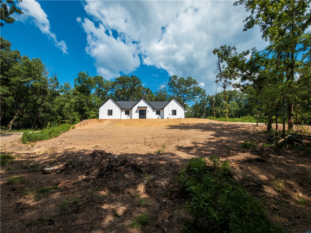 Newly constructed white board-and-batten home feat