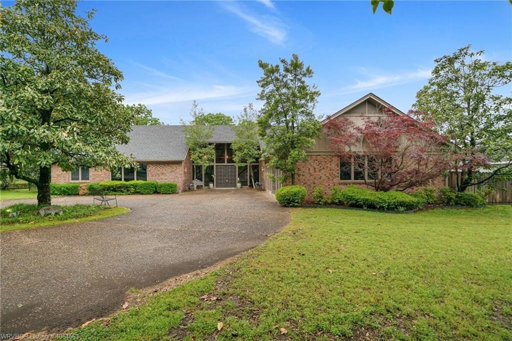 Listed at $599,000 Beautiful custom-built home that has never been on the market! Situated on 1.32 acres in the center of town with a large backyard, workshop and 6 car garage/RV storage and a 2 car carport. This classic style home possesses timeless quality, elegance, and livability. With three living areas, the kitchen features solid surface counter tops, double oven, eat-in kitchen/breakfast bar, and a wood burning fireplace off the den. Also included is the formal dining, large master bedroom suite located on the first floor, oversized playroom with custom cabinets and walk-out front entry. In addition is the large utility room, 3 bedrooms upstairs and 2 downstairs with an abundance of storage. Youāll also find gorgeous tile floors, lots of natural light and quality craftsmanship. In addition is a large covered back porch that offers much privacy for outdoor entertainment and enjoyment.