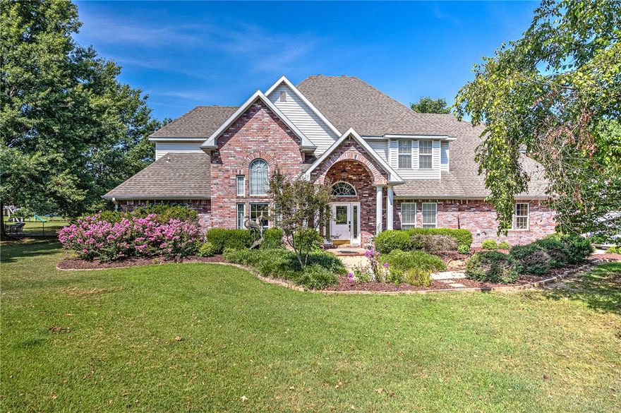 A welcoming foyer greets you. Office with French doors flanks the foyer on one side and the dining room on the other. Both have a wonderful view of the large front yard and beyond. Just past the foyer is the living room which has a soaring stone fireplace and large windows, for views of the large deck and backyard. The spacious kitchen includes a breakfast nook, and counter seating and cozy details. The master bedroom has a beautiful fireplace and door leading out the deck. The en-suite is spa-like with private shower, jetted tub, double vanities, heated floors and water closet. Bonus room on second floor is light and roomy. Perfect for a media room, exercise room or playroom. Outside is an enlarged deck with a kitchen. Two-level garage, perfect for craft room or even more living space. At the back of the property is a 30 x60 pole barn, again uses are endless. No restrictions on the acreage! If you are looking for a luxury property in a country setting, this one is for you!