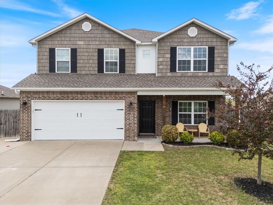 Welcome home to the Lakewood Subdivision in Lowell! This 4 bedroom, 2.5 bath home is perfectly situated near Pinnacle Hills shopping, dining, and easy access to I-49. Just minutes from Janie Darr Elementary School and Mt Hebron Park. Inside, the spacious main floor common areas will make it easy to place furniture and entertain your friends with ample space to create your own flow. The kitchen features granite countertops with island seating and plenty of room for a kitchen table. Large walk-in pantry, half bath and laundry room also on the main floor with all hard flooring downstairs. Upstairs, you’ll find all 4 bedrooms, 2 full baths, and a generous bonus room ideal for playroom, home office, or media space. The primary ensuite boasts a large walk-in closet for ample storage, and ensuite bathroom with double vanities. New roof and gutters in 2025, expanded driveway with widened gate, and covered patio with awning in a fully fenced backyard. Don't miss out on the opportunity to make this open concept home your own