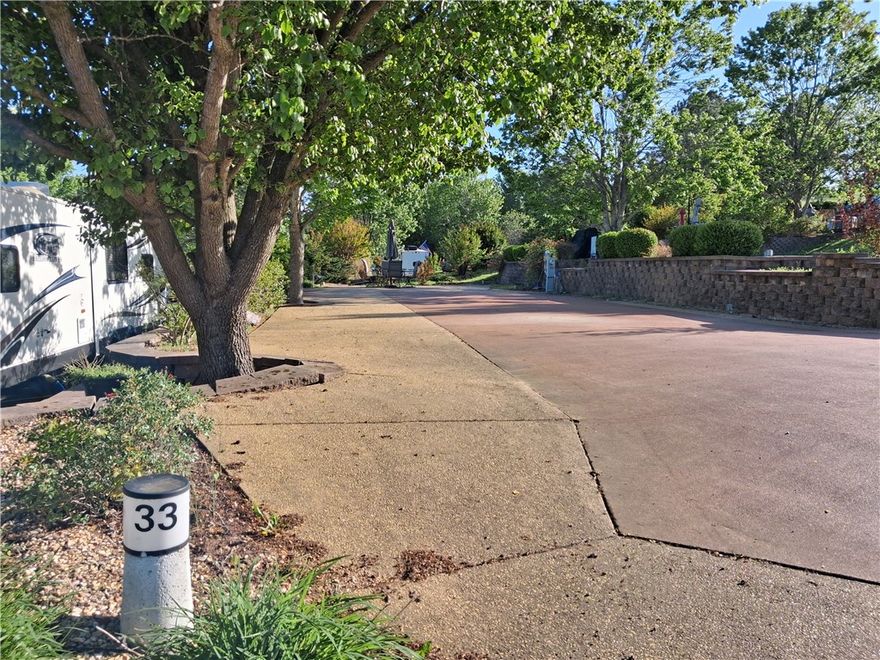 This Large Spacious Back in lot has been recently loved on! Simple landscaping with knockout rose bushes will have you falling in love with the views of Table Rock Lake from every window of your recreational vehicle. Level Parking pad is wide and deep accommodating some of the largest RVs enthusiasts seeking adventure. Water features of the resorts surrounding area will have you falling love with the sounds of nature again and again. Plenty of room for more improvements. Bring your fire pit and lounge chair, you have memories to collect