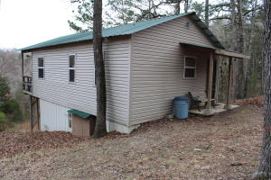Weekend retreat in the woods near Buffalo National River and the ghost town of Rush. Sit on the back porch and enjoy a glass of wine while soaking in the serenity and views while listening to the spring below. This cabin has water from the spring on the property and a full bath, kitchen and bedroom area. Two sets of double doors open to a deck overlooking the valley. Only minutes to the river and many hiking trails or stay on your property and explore the cave and spring.