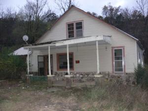 4.5 a/c m/l with house will be offered at public auction; house will require extensive repair; check with Bergman Rural Water for water access; Auction is Dec. 12, 2015 at 10 A.M.; ''AS IS'' listing