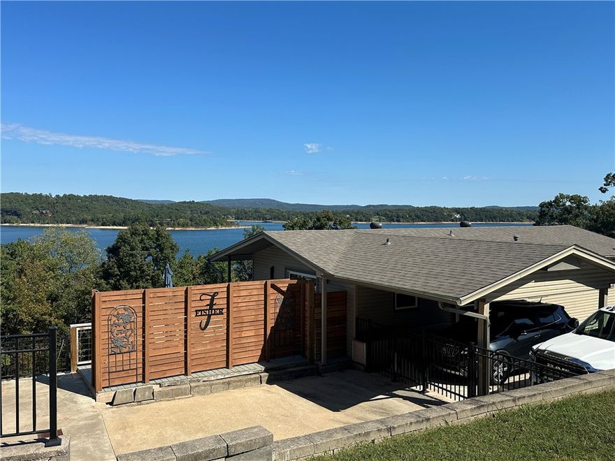 PHOTOS TO COME. Your Beaver Lake getaway awaits! This 1,840 sq ft home offers the perfect blend of comfort, convenience, and outdoor adventure. Nestled on a scenic .96 acre lot w/direct water access, it's ideal for anyone who loves lake life, entertaining, or simply relaxing with a view. The main level offers a large kitchen w/ample storage, a half bath, & 2 living areas. Downstairs you'll find 2 large bedrooms w/sliding glass doors leading outside, washer/dryer, & a recently updated full bath. Outside, enjoy two large decks w/stunning lake views-- perfect for entertaining. The 30x40 shop is a major bonus offering space for boats, ATVs or a full workshop. It is equipped w/a pellet stove, large bar, kegerator, work benches, shelves & a plumbed room ready to be finished out as a bathroom. You will also find a 12x40 heat/cooled bonus room w/a wall of windows. Jump in your included Kawasaki Mule & drive down to your shared boat dock which includes a 10x26 slip & front mount lift w/new floats. Come enjoy the lake life!
