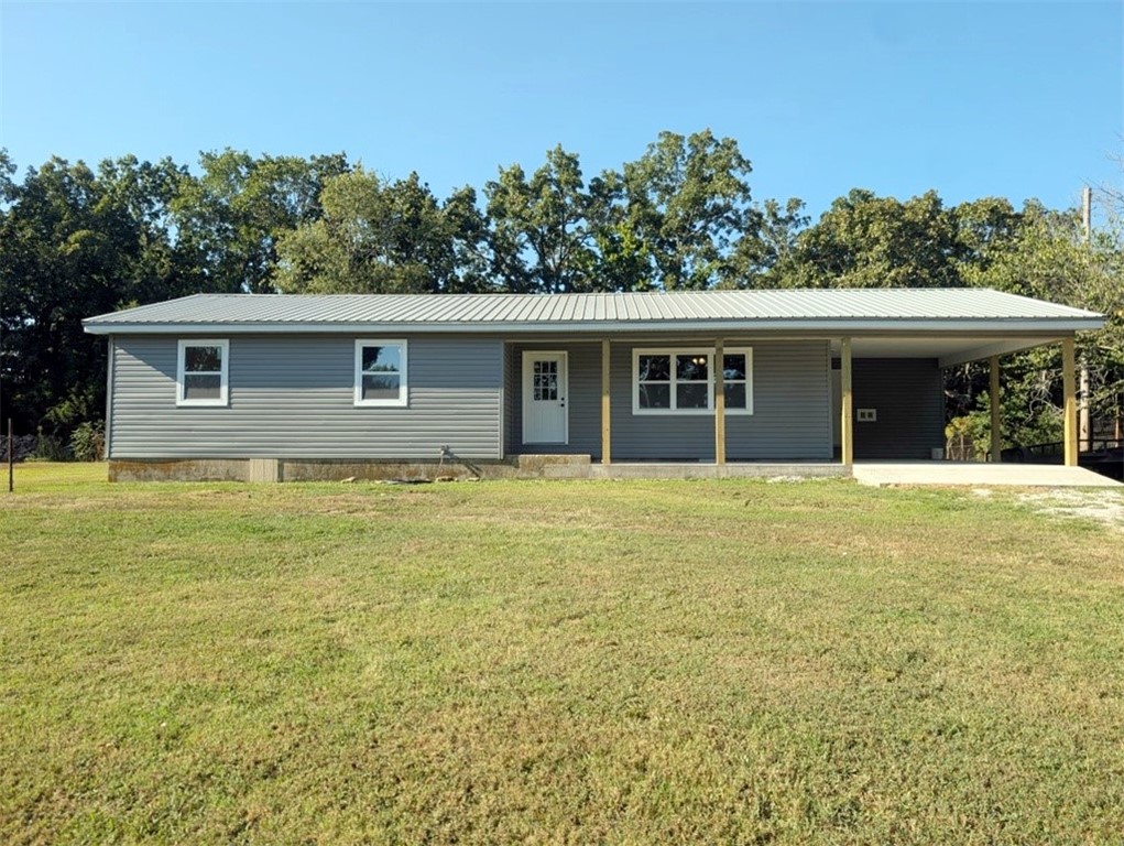 If you like country living close to town, this may be the place for you with this completely remodeled 3 br, 1 - 1/2 ba home on 0.5 acres m/l. The list of recent improvements include new: windows, siding, front porch, back porch, hvac, flooring, paint, kitchen cabinets, appliances, water heater, drywall...the list goes on & on. Property has no restrictions & has room to build another home. All #s are approx, square footage per assessor