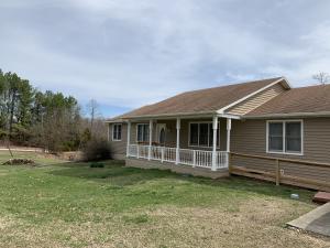 Four bedroom three and half bath home overlooking a large pond. Three car attached large garage with storage room. Huge open rooms with tons of storage in the home. Park like setting to view from the back deck.