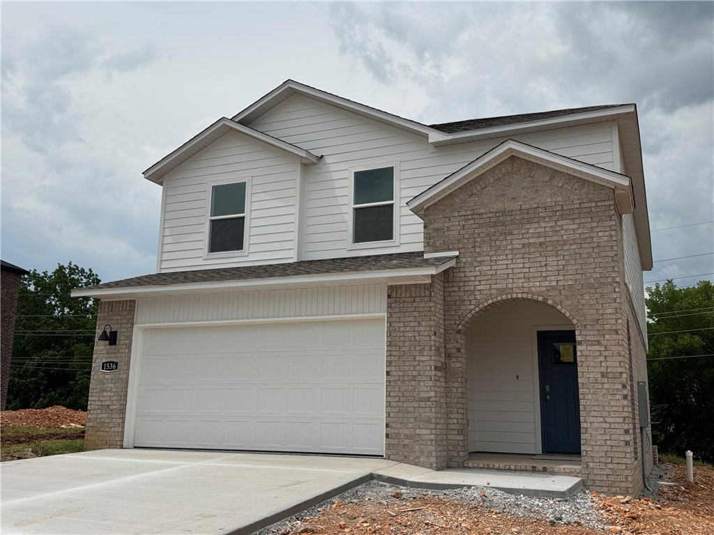 The Gorgeous Garfield plan in Nature Walk, located in Springdale! These brand-new homes will have a brick and Hardie® siding exterior! This plan offers 4 bedrooms and 2.5 baths! Living room will showcase a beautiful and modern Electric Fireplace with Poplar Mantle and a ceiling fan. This home will have LVP downstairs and Carpet on the stairs and in all upstairs living areas. The kitchen features 36-inch cabinets, lovely appliances and quartz countertops and tile backsplash. The primary bedroom has a fabulous ensuite, dual sinks, with a walk-in shower with tiled walls. LED lighting throughout. High efficiency AC with programmable Wi-Fi thermostat. Front, side, and PARTIAL back sod for the larger lots. Come find your dream home today! Taxes and Parcel TBD. Garage Door Opener!