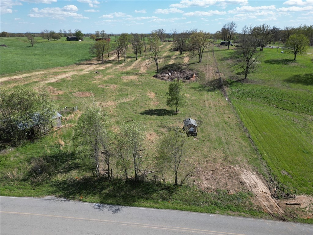 Welcome to this piece of real estate offering 9 acres of opportunity on a paved road. This parcel features mostly open land with a gentle roll, providing a picturesque setting for your next home. The slight elevation changes add character and charm to the landscape, creating a unique canvas for your vision. Don't miss out on the chance to make your mark on this well-positioned piece of land. No mobile homes.
