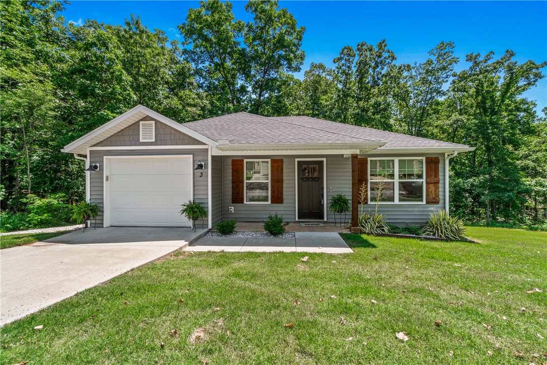 Stylish, functional, and move-in ready—this home has the upgrades that make a difference. Inside, you’ll find modern finishes like a shiplap accent wall, recessed lighting, and a standout kitchen with quartz counters, two-toned cabinets, and floating shelves. Durable laminate and ceramic tile flooring run throughout, and upgraded double-pane windows help with energy efficiency. A 60 AMP EV charger, smart thermostat, and security system add even more value. Outside, a rock path leads to a private backyard, and the front landscaping adds great curb appeal. All this in a prime location near the Back 40 Trails, Blowing Springs Park, Lake Rayburn, and just minutes from shopping, healthcare, and 71B access.