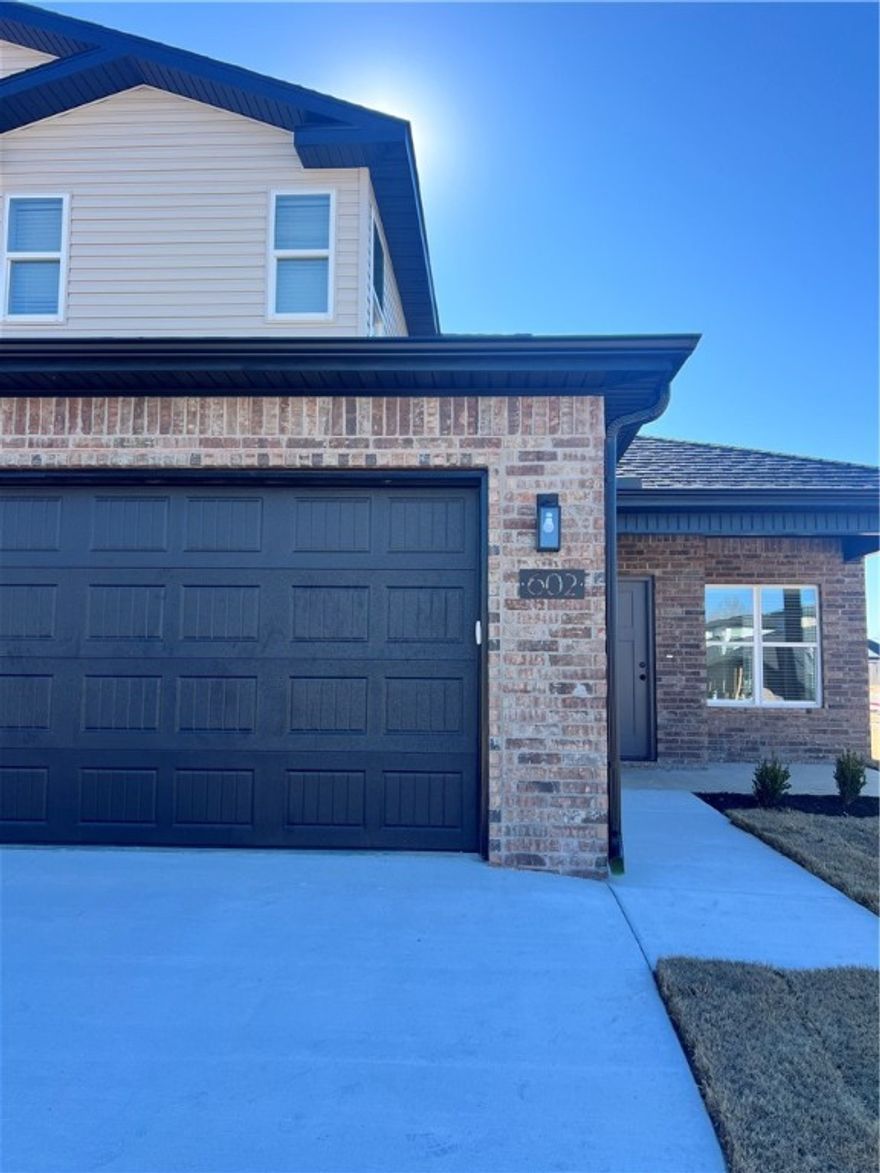 New Construction! Move in Ready Town home style Duplex offering 3 bedrooms and 2.5 baths in a great Centerton location. The main level features LVP flooring with upgraded carpet on stairs and second floor. Kitchen comes equipped with a refrigerator, and the home also includes a washer and dryer for added convenience. Enjoy an attached 2-car garage, a private patio, and a fenced backyard. EV plug in Garage. Located close to area schools, the Walmart Distribution Center, and with quick access to all Centerton and Bentonville amenities. Renters are responsible for all utilities and lawn care.