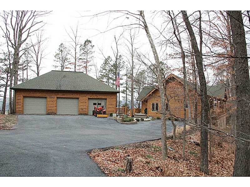 Spectacular views from this custom built log veneer home. 6" framed walls with split logs on interior & exterior. Energy efficient with master on main level, loft den & office upstairs, 3 bedrooms & den downstairs. Granite counters in kit, 3 car detached,has full bath.