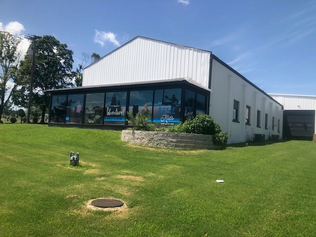 The property is located on a major traffic thoroughfare in NW Arkansas. Located at 608 S 8th (Hwy 71), the frontage building has a traffic count of 26,000+ VPD. The T5.2 zoned building has retail-office space(1168SF) in the frontage part of the building and open warehouse, light assembly, manufacturing in the remainder of the building (7672SF). Building is insulated with heat and air conditioning to almost all of the structure. Heating to 100% of the building and air conditioning to the front office display portion of the structure and can be expanded to the entire remaining portion of the structure. The building has three phase power and two 14' overhead doors.