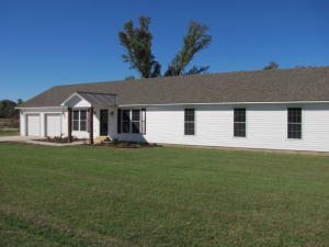 This spacious 4 bedroom home is practically new and has all the bells and whistles including beautiful wood flooring, an open floor plan, designer kitchen, 2.5 baths, 2 car garage, and a huge master suite! All this on two lots in the country! Get all the room you need at the price you can afford!