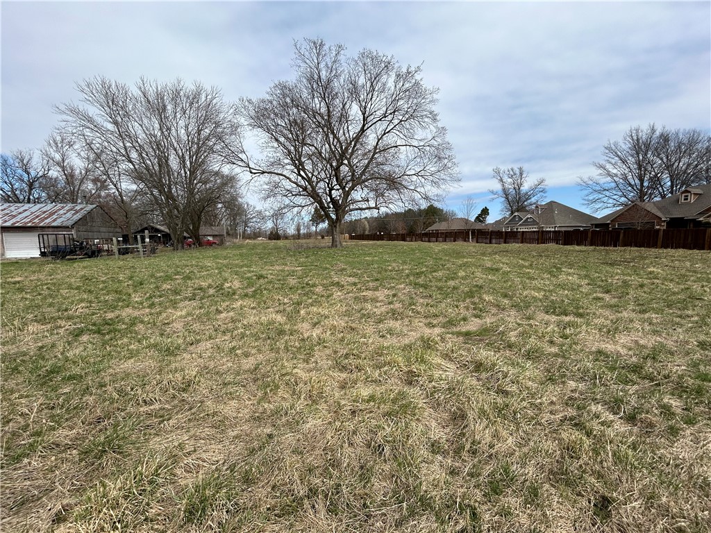 This 3.12 acres is located on corner of Slack & Crawford Streets. Property is L shaped, cleared flat land with no buildings. It is adjacent to Elkhorn Subdivision. Must apply with city of Pea Ridge for rezoning & development. Listing agent is related to sellers.