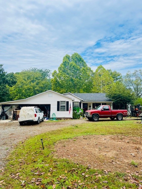 Welcome to this cute country home featuring 3 bedrooms and 1 full bathroom. This home has a total of 2,167 heated sqft and features a well-equipped kitchen with beautiful wood cabinetry. This property would make a great hobby farm with 2 spacious acres which include a fenced in backyard and several sectioned off areas that are fenced as well. The property includes a chicken coop, a barn perfect for farm animals, a large pole barn with attic storage and several other outbuildings, as well as a gazebo, perfect for enjoying the serenity of the country setting surrounded by pastures. This property is located on a quiet road with low traffic. Interior photos coming soon! Call today to schedule a tour!