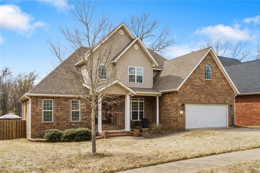 This 5-bdrm, 3 bath home in the Bridgeport subdivision along w/ a heated saltwater pool, offers both comfort and private entertaining space. The open-concept split floor plan features a primary suite with an en-suite bath and walk-in closet. A second main-floor bedroom off the family room has its own bathroom and is perfect for a college student or mother-in-law. Upstairs, you'll find three additional bedrooms and a full bath. The finished walk-out basement leads to a beautifully landscaped backyard, offering ultimate privacy with a wooded backdrop and creek. Conveniently located near the business district, fire station, hospital, schools, and shopping centers.  Only 12 min to the U of A.  This home sits on a level, landscaped lot. Interior include blinds, ceiling fans, an eat-in kitchen, granite counters, pantry, and a washer/dryer connection. Included appliances: built-in oven, dishwasher, gas cooktop, microwave, refrigerator, washer, and dryer. Seller is offering a $5000 credit for updates of buyers choice.