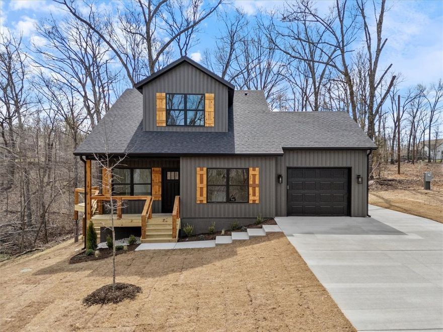 New construction with loads of charm! Bring your boat and your pickleball equipment.  You are two minutes to the Branchwood Rec Center for their indoor pool, fitness and pickleball courts and two minutes to lake access at the Stoneykirk ramp for Loch Lomond lake!  This two bedroom home has finishes you'd expect at a much higher price point.  Quartz counters in the kitchen and baths, great closet space in the primary bedroom and a fully tiled shower in the primary bath.  A level driveway with a nice back yard buffered by mature trees.  Stunning curb appeal with dark vinyl siding and cedar accents. A lovely street with convenient access to the Bypass.  Enjoy all that Bella Vista has to offer!  **PHOTOS ARE OF A PREVIOUS HOME THAT IS THE SAME FLOOR PLAN** Completion approximately mid May!