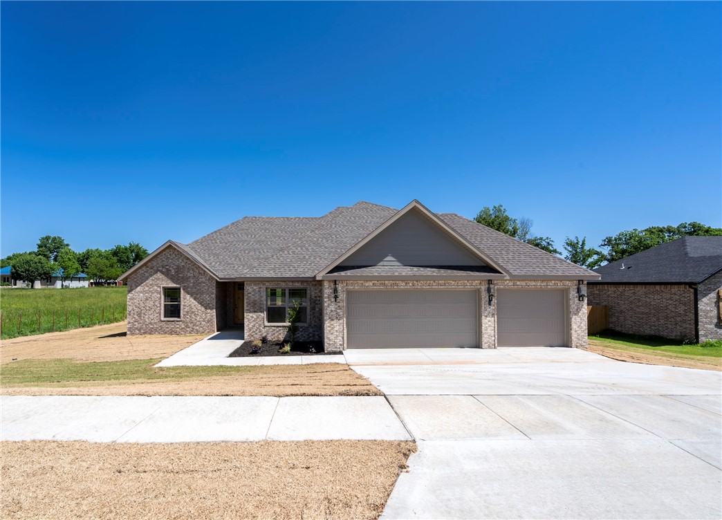 Seller offering a $5,000 credit towards closing costs! Welcome to your dream home nestled in a brand new subdivision! This modern, newly-constructed house sits on a sprawling 1-acre lot surrounded by peaceful, verdant scenery. This home boasts a 3-car garage with a split floor plan to ensure privacy and convenience for all. Greeted by the warmth of wood-look tile flooring, large vaulted ceilings, and sleek quartz countertops, the home also features a spa-like master suite with encompassing energy-efficient windows throughout the home that bathe the interior in natural light. The spacious, upstairs living room is a versatile space perfect for relaxation, entertainment, or a home office. The large, desirable backyard beckons for outdoor entertaining and leisurely moments. Don't miss the chance to make this home yours; where modern luxury meets the beauty of nature. Now featuring High-Speed Cox Internet! Property Taxes TBD.