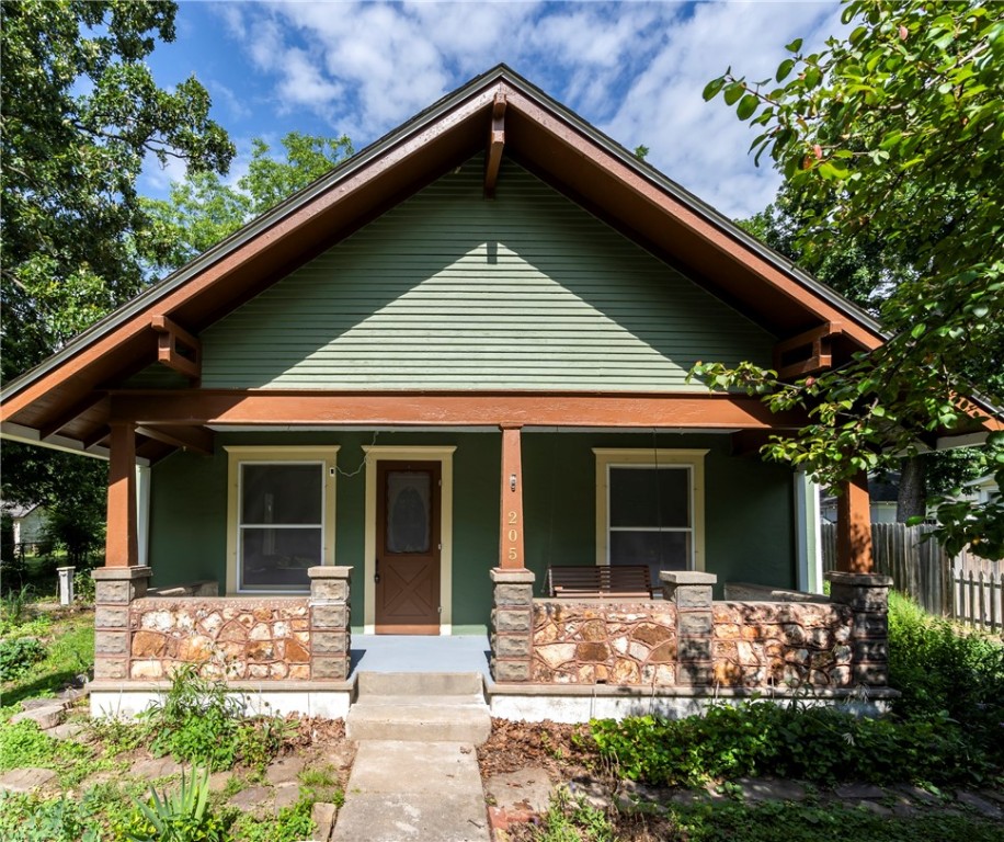 Step into timeless character blended with modern updates in this unique 2-bedroom, 2-bath home. Built in 1901, this home retains its historic charm including a keyhole and photo rail, while offering thoughtful updates, including a large primary suite & kitchen designed for both style & functionality with butcherblock & Corian counters, plus a butler's pantry. The upstairs loft-style bedroom is ideal for a home office, creative studio, or quiet retreat. Throughout the home, youāll find a blend of original character and modern touches, perfect for those who appreciate history with comfort. Outside, you'll find the landscape was designed as a pollinator-friendly haven, the naturalized garden space has been intentionally cultivated to attract bees & butterflies creating a vibrant, living ecosystem right in your own yard. Detached carport & shop with rear parking, this home offers small-town charm with unmatched convenience. Donāt miss your chance to own a piece of Gentryās history with this one-of-a-kind property!
