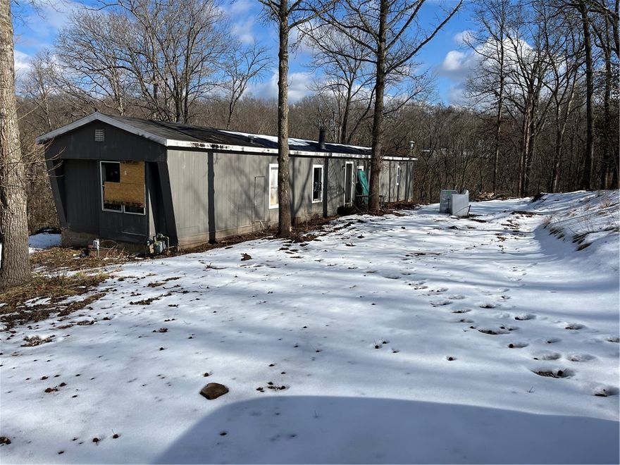 Great opportunity to remodel the mobile home on site or, have it removed and build your dream home! Just a short drive from town it has potential to be a good location for whatever you are looking to do! Utilities can be turned on for an inspection and the property is being sold AS IS. schedule your showing today!