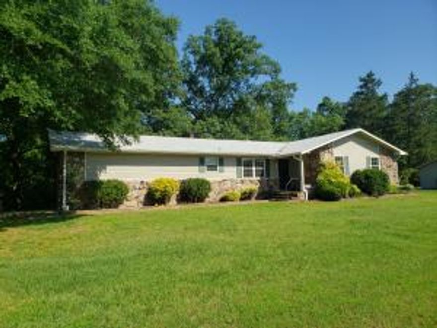 Home, shop and over 1 acre of land...3 bedrooms, 2 bathrooms, living room with fireplace, back covered deck with  view of wet weather creek and chain link fenced area in back yard. The shop is amazing... 30 x 40 with central heat and air, 1/2 bath, rool up door and office space. There is also an additional building for extra storage. New roof March 2016.