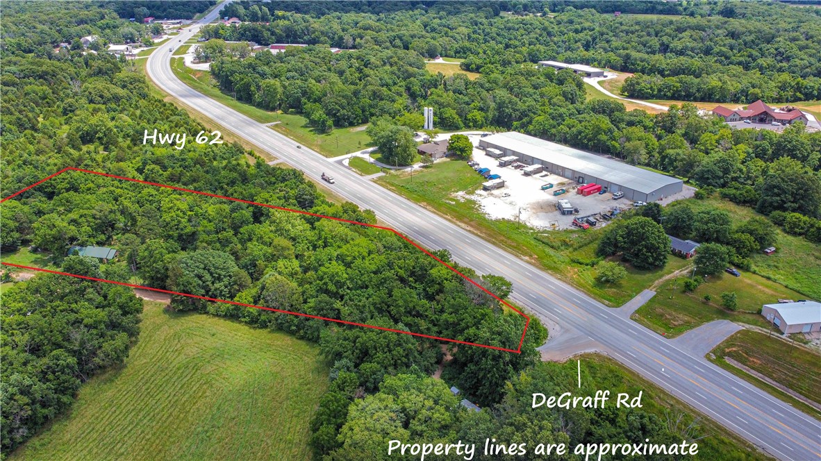 Outstanding development opportunity, 4+/- acres of prime real estate with excellent road frontage on Hwy 62 in Rogers. Property offers approx 360' of road frontage. Property has high exposure from high daily traffic count. This strategic location is ideal for commercial, mixed use or retail space. Don't miss this rare opportunity in a rapidly growing area. Buyer to verify utilities, zoning, development requirements.