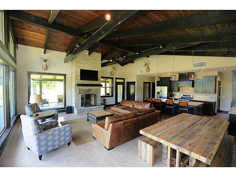 Enjoy the view at this scenic hunting retreat or private residence. 357 acres to explore, including timber, pasture, 3 ponds, & natural springs. 1,998 SF furnished house/cabin built in 2012 w satellite/internet/security cameras w attached 5640 SF shop.,Three tree stands, 2 raised steel box blinds & 4 ground steel box blinds. Trails cut throughout & 3 clover food plots. Includes 4 Texas Hunter Products hanging feeders & bunk style game feeders. Pavement to property driveway.