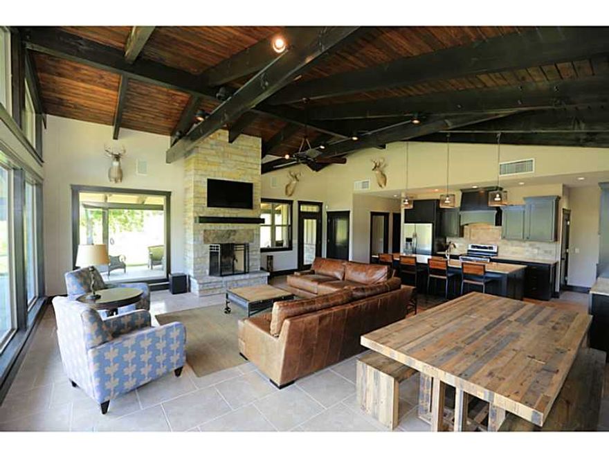 Enjoy the view at this scenic hunting retreat or private residence. 357 acres to explore, including timber, pasture, 3 ponds, & natural springs.  1,998 SF furnished house/cabin built in 2012 w satellite/internet/security cameras w attached 5640 SF shop.,Three tree stands, 2 raised steel box blinds & 4 ground steel box blinds.  Trails cut throughout & 3 clover food plots.  Includes 4 Texas Hunter Products hanging feeders & bunk style game feeders.  Pavement to property driveway.