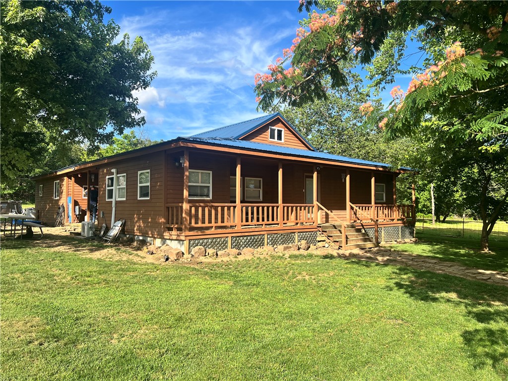 Only 25 minutes to Fayetteville but all the privacy you would need. Scenic views. Close to White River and a stocked pond ready to fish. Two parcels included in the list price. Almost 6.25 acres offer plenty of room for whatever you want. Lots of fencing and two outdoor buildings. New metal roof in 2017. Above ground pool can convey with an acceptable offer.
Parcel#001-02879-000 house
Parcel#001-02879-003 has pond behind house