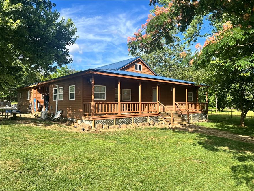 Escape to a serene haven with breathtaking views, situated on nearly 6.25 acres only 30 minutes from Fayetteville. This exceptional opportunity presents a spacious residence, ideal for outdoor enthusiasts, with ample space for gardening and animals,a stocked pond, and nearby White River access. The property features a newer metal roof, bonus room, and two barns. FHA should be possible. 
Parcel#001=02879-000 has the house
Parcel#001-02879-003 has pond behind house
Security cameras and above ground pool do not convey.
Current children in house attend Elkins Public Schools.