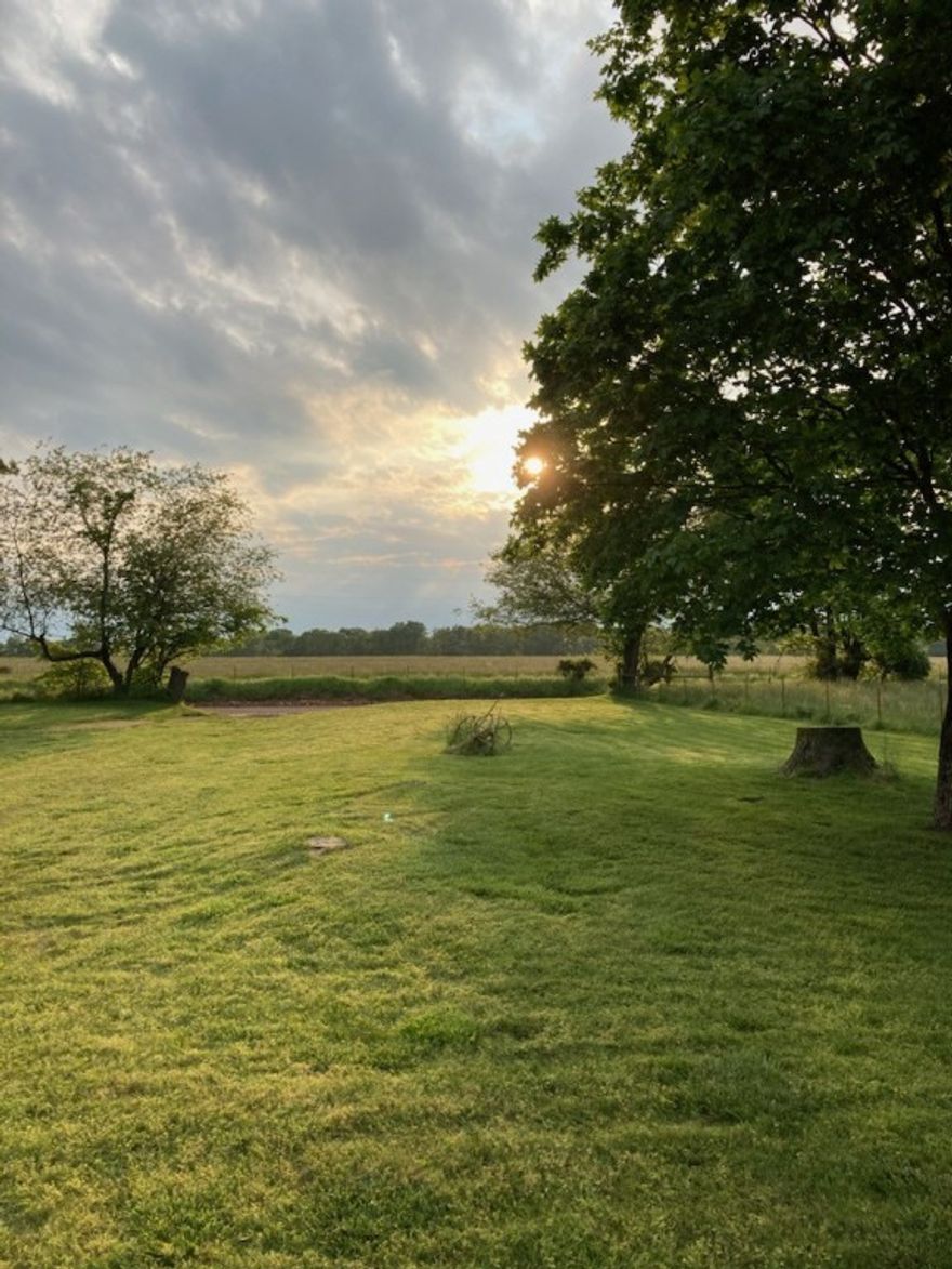 Spanning 39.96 acres of level terrain in the core of NW Arkansas' growth (Benton County), this land is ideal for a private estate or residential development, situated 1.5 miles from the main highway. It offers convenient access to Bentonville, Rogers, Springdale, and the NW Arkansas National Airport, located just 7 miles away. Nearby, housing developments are emerging a quarter mile and one mile from this site. The property is accessible via paved roads at the SE corner on Peterson Road and the NW corner on Digby Drive, with roads bordering three sides. It features well water, a city water manhole cover in the front yard, and an owned propane tank on-site. Black Hills Energy's gas pipelines traverse the southern and western boundaries within the property, with existing access points on these sides. Prospective buyers are responsible for conducting all necessary property inspections.