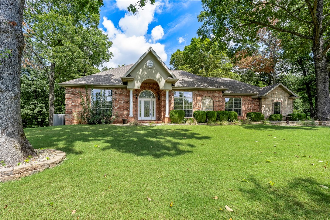 This immaculately maintained all brick home is so private yet conveniently located. It is just what so many families say they are looking for. 15 minutes to Rogers, Bentonville, and Beaver lake. The Sugar Creek golf course is almost in your front yard. Enjoy wildlife all around. Other great amenities in this home include the beautiful coiffered ceilings in the living room, custom cabinetry throughout including the builtins and the 27ā deep epoxy floored 3 car garage, the gas HVAC system recently updated in 2022 and the new roof in 2020 as well as the stainless kitchen appliance package.