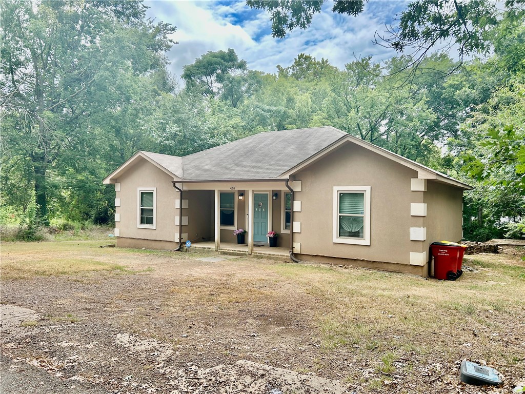 Check out this fully furnished 3 bed, 2 bath home built in 2017, located in a quiet neighborhood. With 1,330 sq ft, a large backyard, and circle drive, this charming property is move-in ready! Recent updates include attic insulation, fresh paint, new carpet in the living room & laundry, new shower fixtures, French drain, back porch railings, and a whole-house surge protector. Appliances (approx. 2 yrs old) includes stainless steel stove, refrigerator, built-in microwave, dishwasher, plus washer/dryer. Furnishings include a living room set, kitchen table with bench, beds, nightstands, desk, bookcase, rugs, curtains, decor, and more. Outside features an old cement cellar with potential for a storm shelter or playhouse, and a filled-in well-perfect for a garden. Home is being sold AS IS. Schedule your showing today.