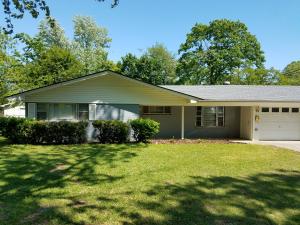 RARE FIND on the west side of town complete with a small shop! This affordable, adorable 1700 sqft home invites you inside to sit by the cozy gas-log fireplace. Featuring 3 large bedrooms, HUGE laundry room & a seperate office/dining rm. All stainless steel appliances in the kitchen featuring a gas stove. The master suite has a private back door to back yard & upgraded facilities in the bathroom such as the sit-in-shower for handicap accessible. Located so close to downtown shopping, grocery stores & the hospital. Roof is 7 years old. Priced to sell at $119,900...you better look at this one before it's gone!