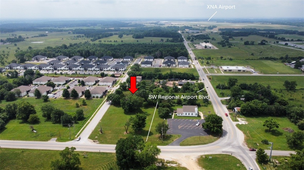 0.5 AC prime location in rapidly growing area of Bentonville. This property is directly situated on Hwy 12/Regional Airport Blvd offering excellent visibility. Just minutes from XNA airport, downtown Bentonville. Property boasts significant road frontage and experiences daily +12,000 vehicle traffic count.
