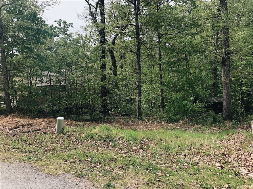 Incredible sewer lot is located in a cul-de-sac just minutes from Metfield Golf Complex, and Lake Brittany. Lot has a common area behind it providing wooded views and plenty of privacy. Design Build services available.