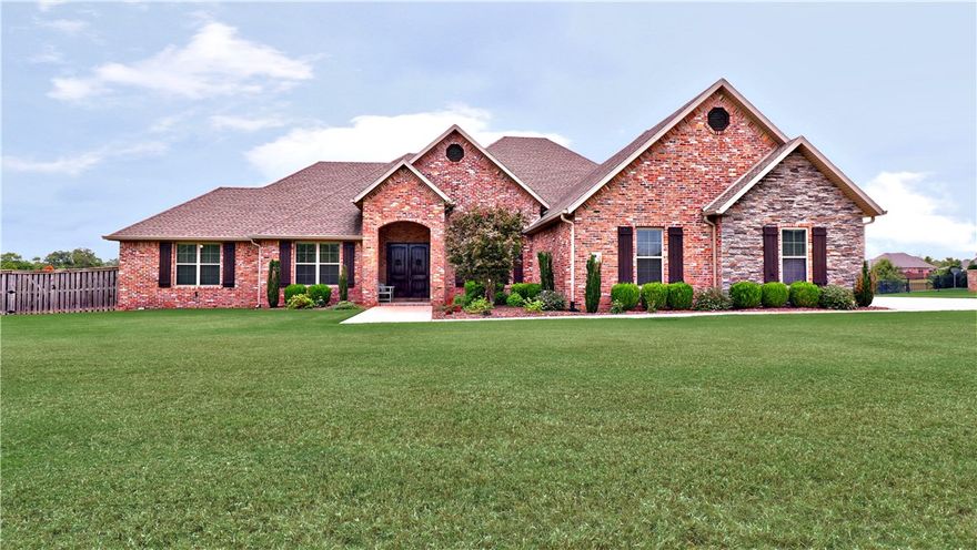 Elegant home sitting on 1.36 acres with 5 bedrooms, 4 1/2 baths, Large Kitchen with cabinets from floor to ceiling and lots of room for entertaining friends and family. Kitchen has built-in fridge and freezer, granite tops, island plus bar top, and pot-filler over cooktop. Family room open to kitchen with fireplace. Executive Primary suite with large walk-in shower, whirlpool tub, open space. Primary closet attaches to laundry room for easy access. Covered & partially enclosed back patio over looks large back yard that is completely fenced with wood privacy fence. Patio has built-in grill and tv outlets. Split bedroom plan has 3 bedrooms on opposite side from primary. Two bedrooms share bathroom room and one of the bedrooms has an on-suite bath. Guest 1/2 bath in hallway just off foyer. Formal Dining room with butler's pantry. Upstairs has large 5th bedroom & full bathroom. Plus, entertainment/bonus room with bar area and mini fridge & fireplace. Oversized garage. Home located in convenient location to Wal-Mart HO.