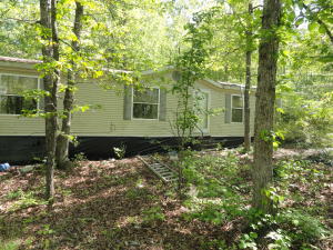 Investment opportunity. Fixer Upper double wide sitting on 5.52 acres. With some sweat equity and repairs, this could be a nice rental or permanent home for someone. There is a custom built storage building on the property that can house your motorcycle, lawnmower or 4 wheeler. Property mostly wooded. 2128 sq foot doublewide. Country feel with town just 1.5 miles away. Large wooden deck 3 bed 2 & 1/2 bath. Paved road to the driveway. Close to Walmart, Red River, Greers Ferry Lake.