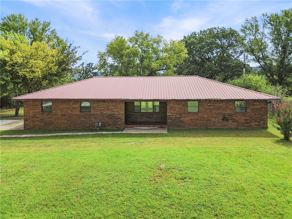 Great location! 1633 Sq. ft brick home located between Prairie Grove and Farmington. Zoned mixed use and has fantastic road frontage on Highway 62. 3 roomy bedrooms, 2 Full baths, open floor plan, laminate wood floors, new dishwasher and a metal roof are just a few of the features. Would make an ideal home, commercial office or excellent investment property. Large 2 car garage with a great workshop area. All situated on nearly an acre of flat land, paved road and close to shopping, trails, and the University.