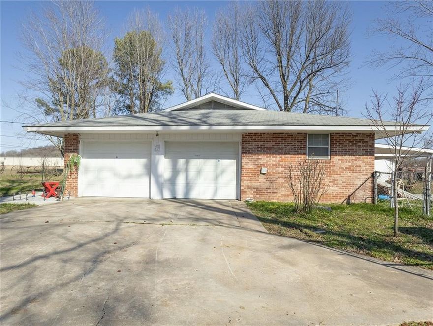 This 1.5-acre property, located near downtown Springdale, offers exceptional potential for future development. While currently zoned for agriculture, it is surrounded by industrial, commercial, and multifamily properties, making it an ideal candidate for redevelopment. The existing home on the site can be utilized for office space, with several sheds and outbuildings offering additional storage or workspace options. With its prime location and surrounding growth, this property provides a unique opportunity for businesses looking to expand or invest in the area. Recent upgrades include-2 new toilets and lines, new stove, new dishwasher, new sink and garbage disposal, new water line, new gas line, new 100 amp electric box. -All new upgrades within last 7 months.
