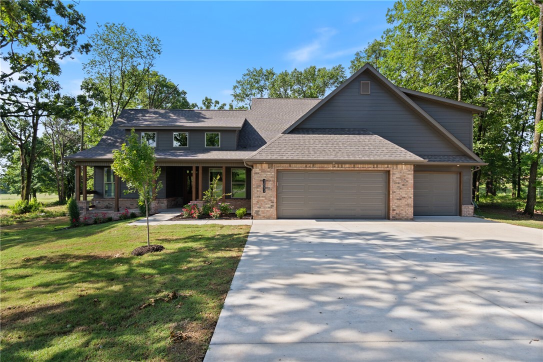 Act quickly—this is a rare opportunity! Discover this beautiful new construction home situated on 1.07 acres. The property features an open-concept living area, kitchen, and dining space, along with four spacious bedrooms and a bonus room with a half bathroom upstairs. Enjoy high-quality amenities, including custom cabinets, 3cm quartz countertops, durable LVP flooring, and LED lighting with under-cabinet lighting in the kitchen. The living room also boasts vaulted beams, adding to the home's charm. Relax and take in the peaceful and serene views from both the back patio and the front porch. This home is located in an excellent area, close to everything that Northwest Arkansas has to offer!