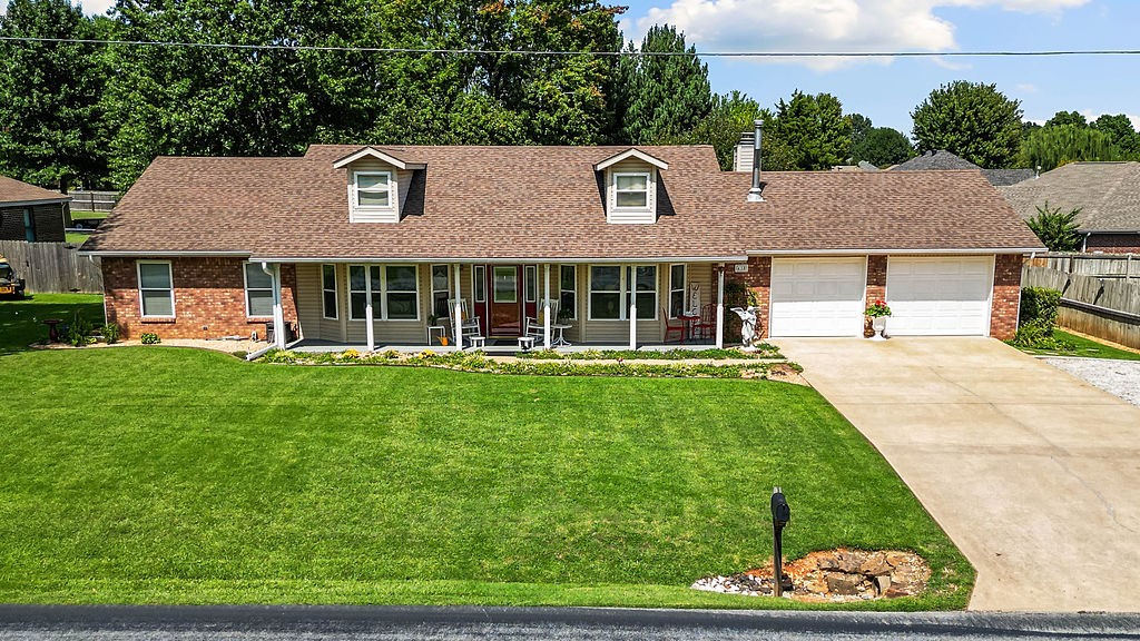 Nestled on a .40-acre lot, this 3 bed/2 bath home is filled with abundant natural light. The large entry way welcomes you into the living room, where vaulted ceilings & a cozy wood-burning stove set the tone for a warm, inviting atmosphere. The primary suite features vaulted tray ceilings, a spacious walk-in closet & an ensuite with dual vanities. 2 additional bedrooms & multiple closets throughout the home offer versatility and abundant storage. The kitchen is complete with ample cabinet space, a pantry, & convenient access to the back deck, laundry room, & garage. The 11x23 covered deck overlooks the large, landscaped backyard with water lines for easy gardening & double gate access for trailers or an RV. A 360 sqft workshop with roll-up door & 220-volt plug-ins, plus a 160 sqft storage shed, provide ideal hobby & project space. The extra-deep 2-car garage adds even more versatility! Don’t miss this thoughtfully designed home that blends natural light, comfort, style, & practical upgrades inside & out!